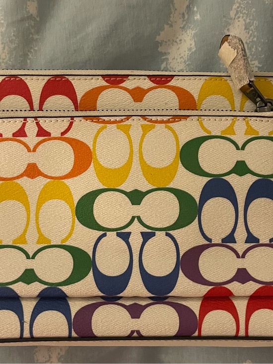 Coach Handbags - Coach Multicolor Signature Clutch in Rainbow Print